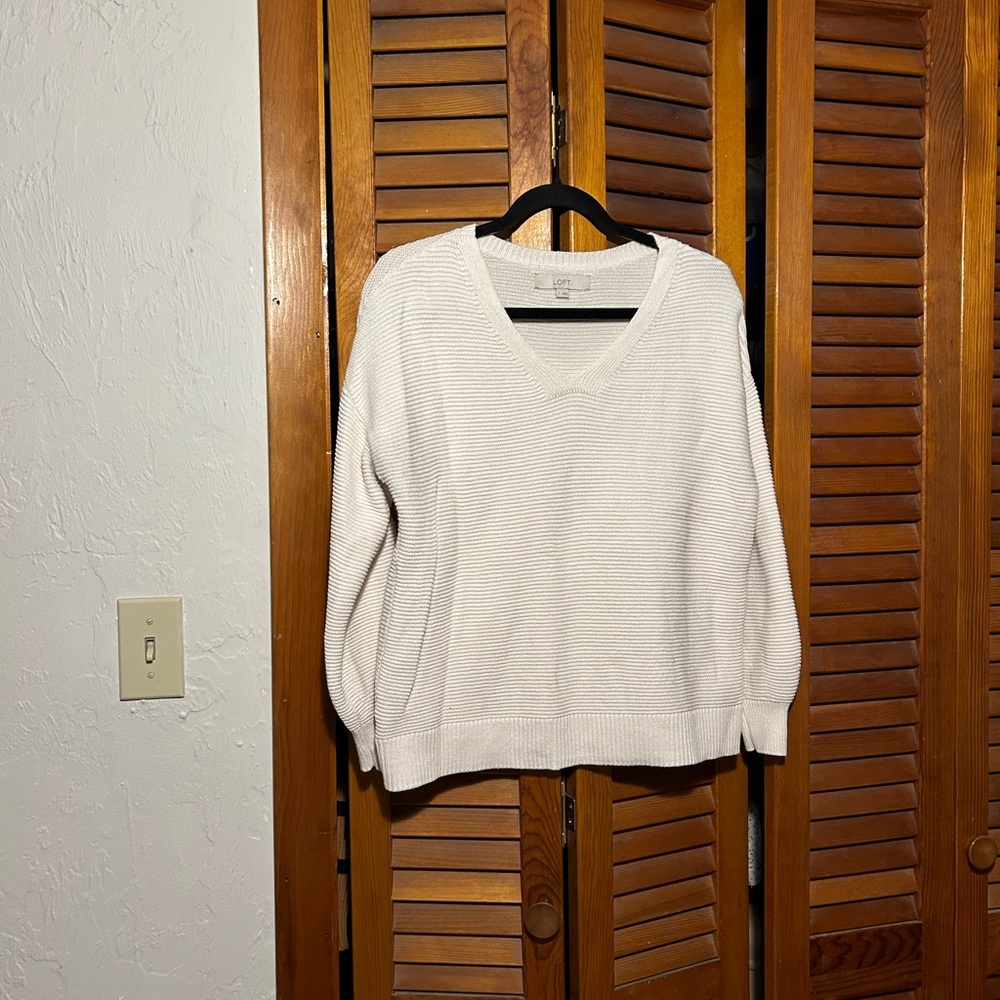 Small, cream colored ribbed sweater